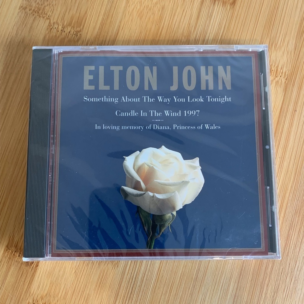 (166)Elton John CD with White Rose Cover